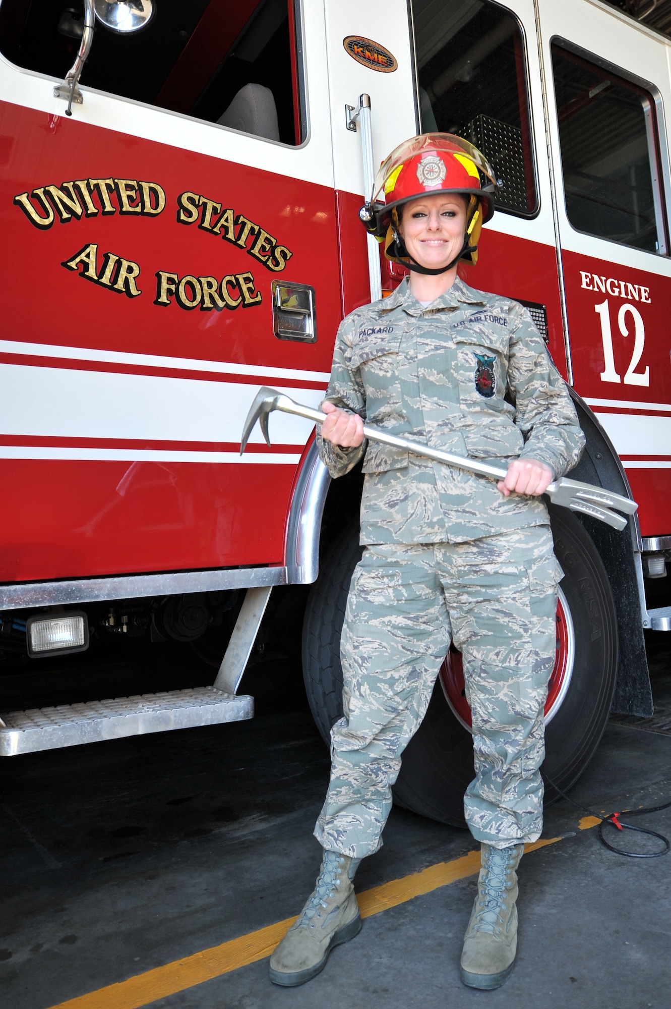 ALTUS AIR FORCE BASE, Okla. – U.S. Air Force Tech. Sgt. Jessica Packard, 97th Civil Engineer Squadron station captain, stands in front of a fire truck March 25, 2014. Packard has served in the Air Force for more than 13 years and has been an instructor for new firefighters, a spokesperson for fire academy recruiting and a positive role model for other female firefighters. Packard has dedicated her life to helping others and exemplified what it means to be a leader in today’s Air Force. (U.S. Air Force photo by Senior Airman Dillon Davis/Released)