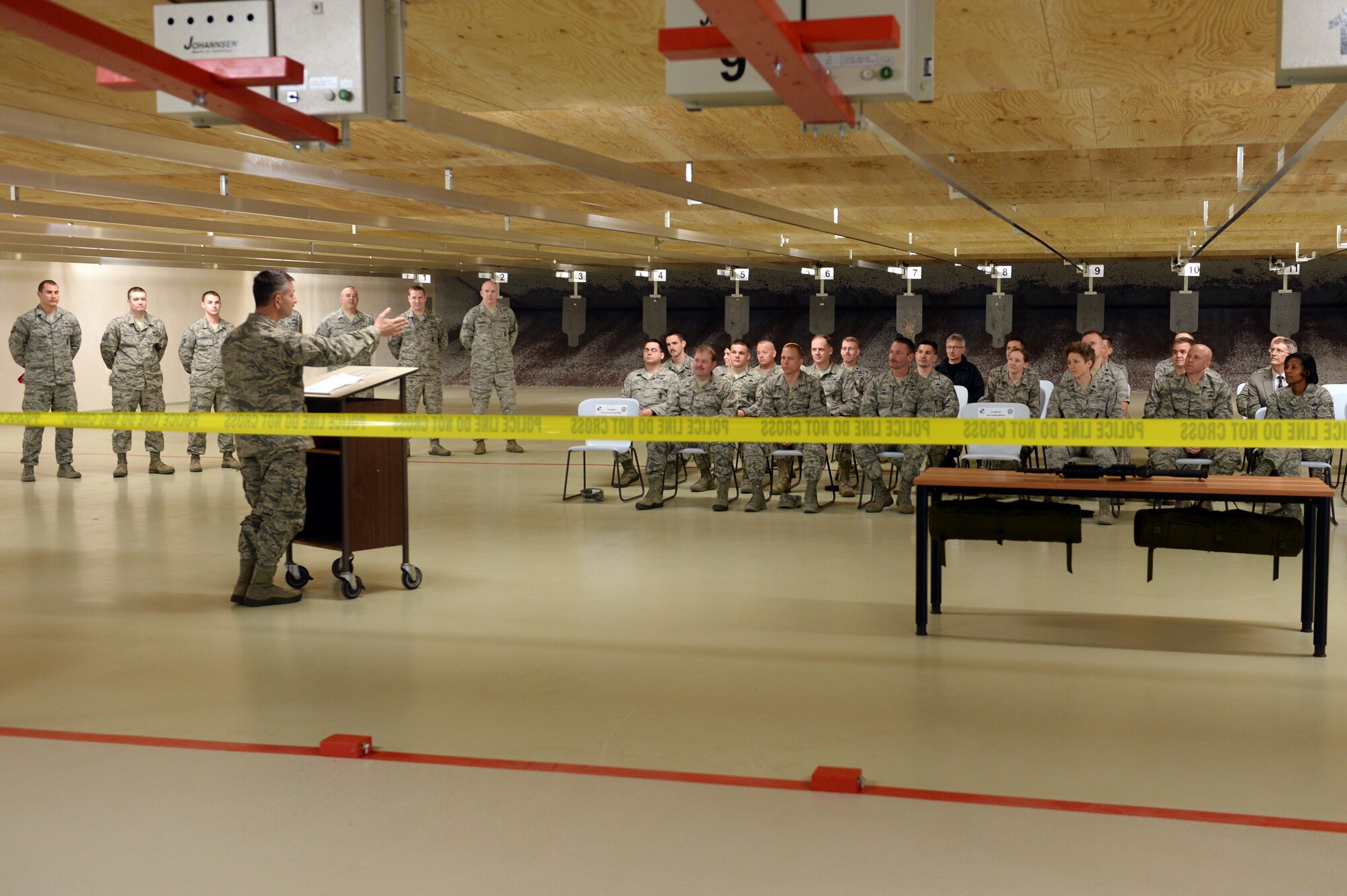 U.S. Air Force Col. David Julazadeh, 52nd Fighter Wing commander, addresses guests at a ribbon-cutting ceremony of the newly-finished Combat Arms facility at Spangdahlem Air Base, Germany, March 28, 2014. The facility reopened after two years of renovation. (U.S. Air Force photo by Senior Airman Alexis Siekert)