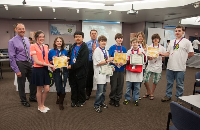 Golden Ticket Winners and teams will go on to compete against Air Force, Army, Marines and Navy teams in the 2014 Department of Defense Math Games Virtual Tournament April 7. The Tri-County DimensionU competition at SPAWAR Systems Center Atlantic, March 28, 2014, on Joint Base Charleston – Weapons Station, pitted more than 90 students from eight local middle schools in a competition testing their math and science skills in online, multi-player educational video games. (U.S. Navy photo/Joe Bullinger)