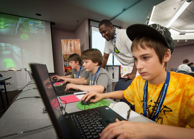 Middle school students compete in DimensionU games at SPAWAR Systems Center Atlantic, March 28, 2014, on Joint Base Charleston – Weapons Station. The Tri-County DimensionU competition pitted more than 90 students from eight local middle schools in a competition testing their math and science skills in online, multi-player educational video games. (U.S. Navy photo/Joe Bullinger)