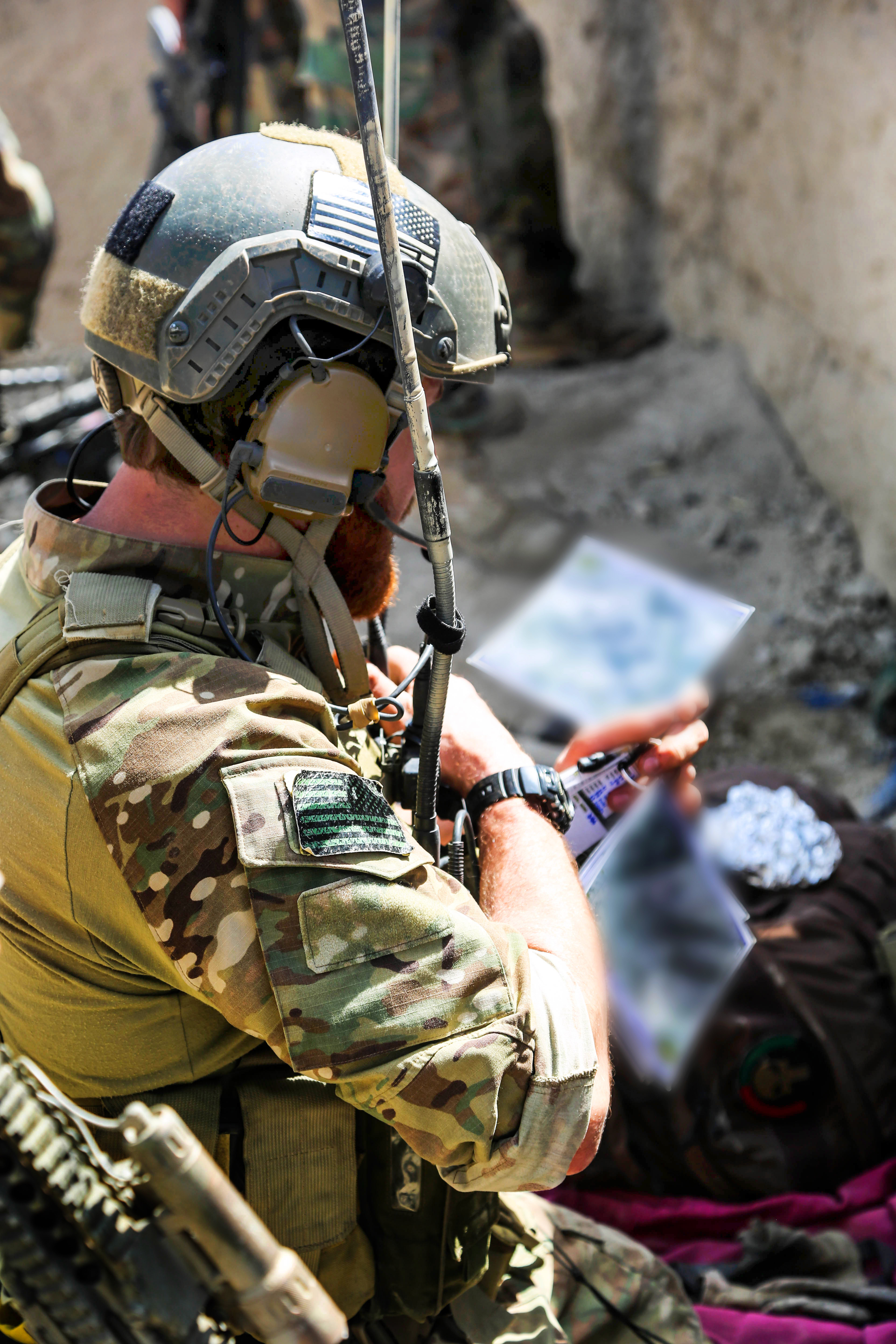 A U S Special Forces Soldier Checks His Map During A Clearing Operation In The Khogyani District