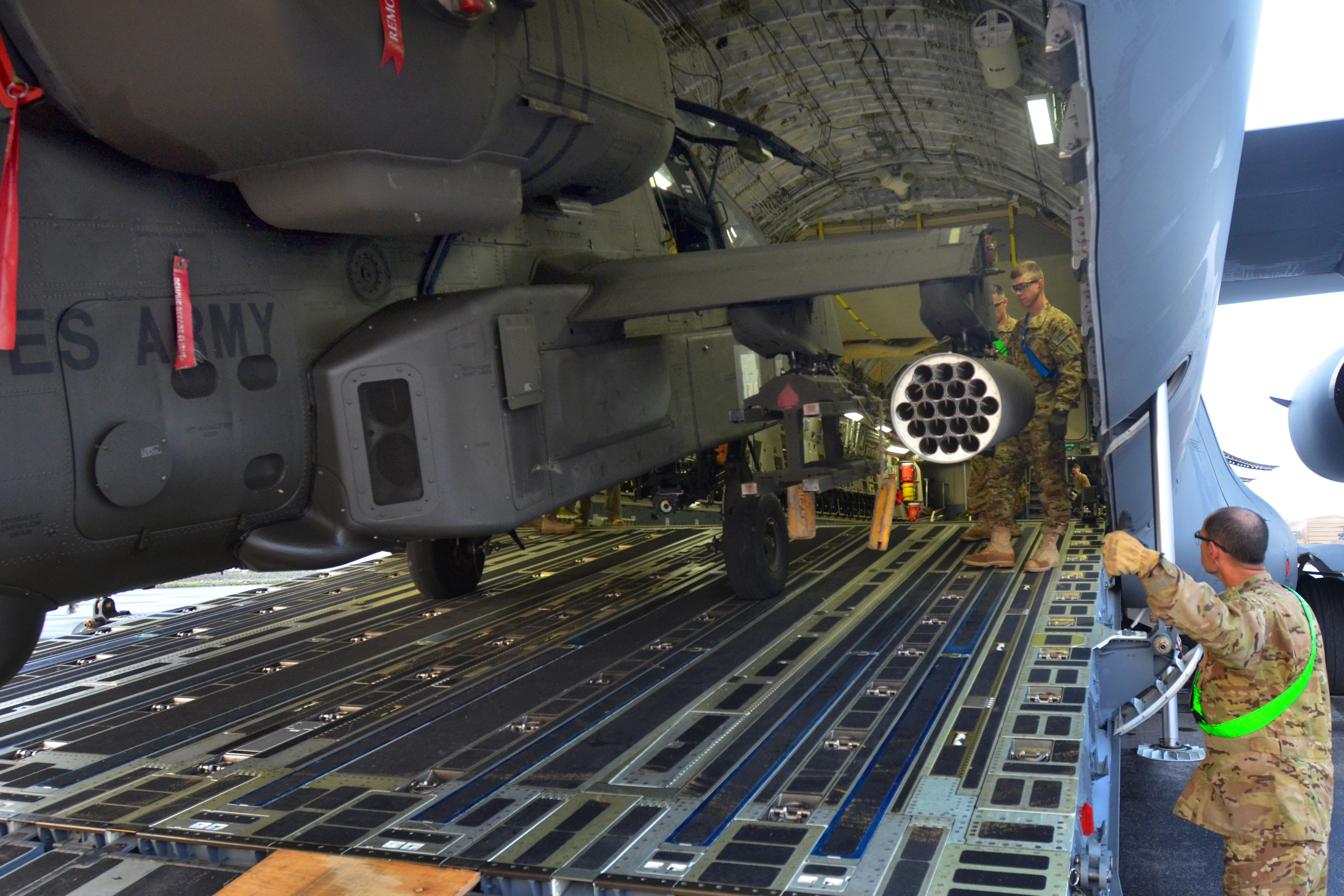 U S Soldiers Guide An Ah 64e Apache Guardian Helicopter Out