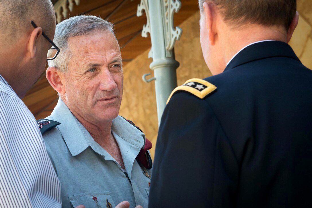 Chief of the Israeli general staff, Lt. Gen. Benny Gantz, center, talks with U.S. Army Gen. Martin E. Dempsey, left, chairman of the Joint Chiefs of Staff, at the Konrad Adenauer Conference Center in Jerusalem, March 31, 2014.