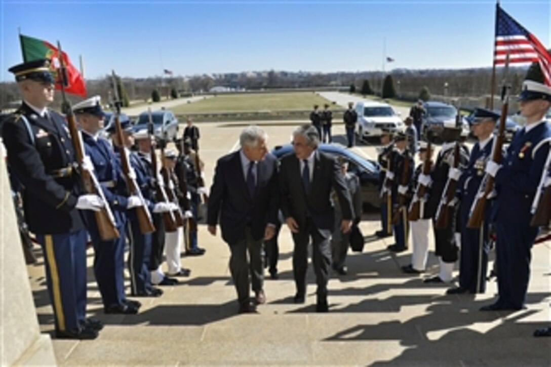 U.S. Defense Secretary Chuck Hagel, left, hosts an honor cordon to welcome Portuguese Defense Minister Jose Pedro Aguiar-Branco at the Pentagon, March 31, 2014. The two leaders met to discuss defense-related topics.