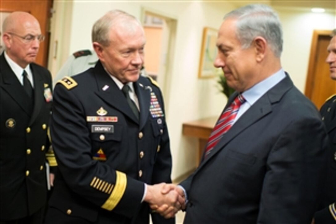 U.S. Army Gen. Martin E. Dempsey, left, chairman of the Joint Chiefs of Staff, shakes hands with Israeli Prime Minister Benjamin Netanyahu after a meeting in Jerusalem, March 30, 2014.