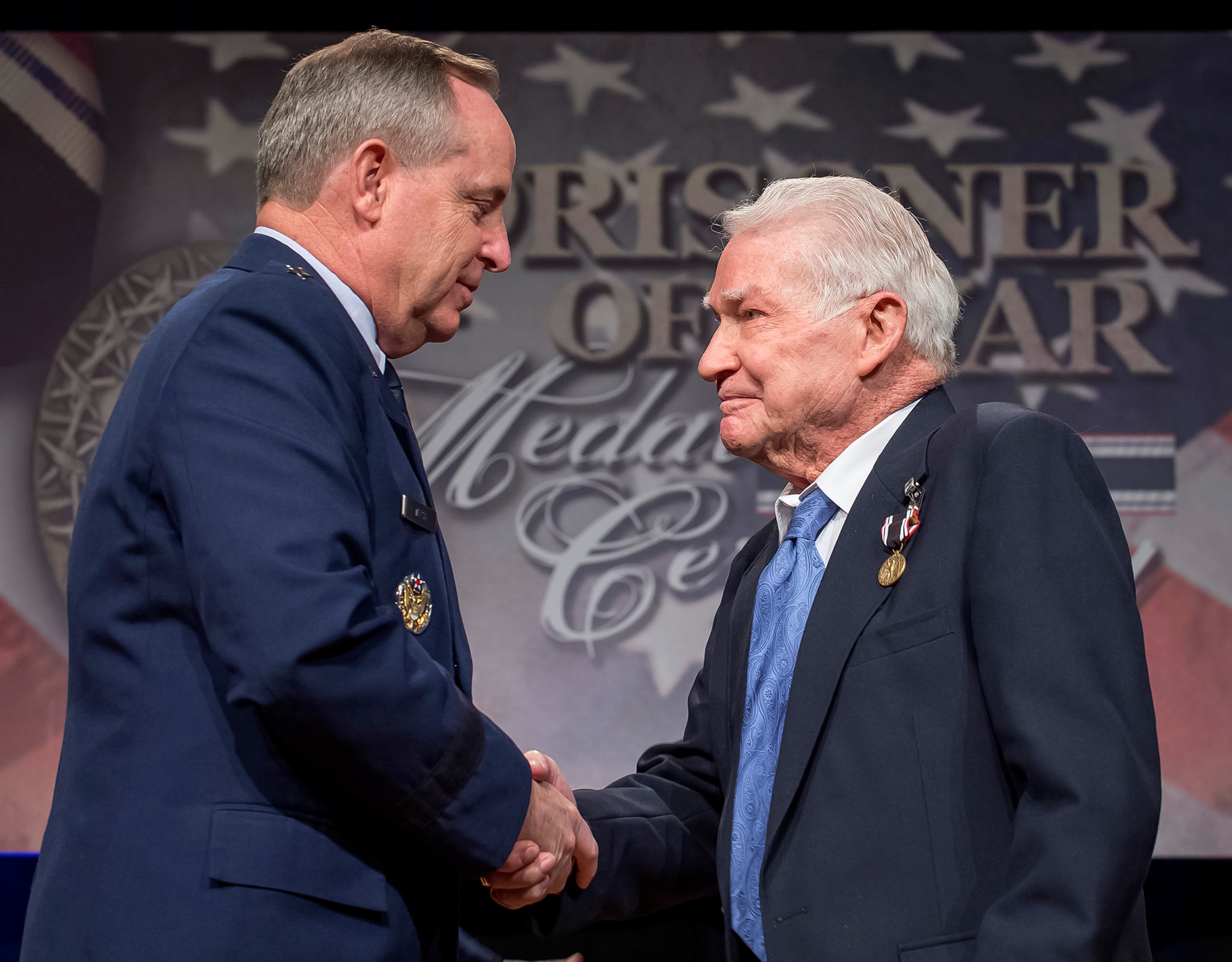 Air Force Chief of Staff Gen. Mark A. Welsh III presented the Prisoner of War Medal to Staff Sgt. John Fox during a ceremony April 30, 2014, in the Pentagon. Fox and his fellow crew members were shot down flying missions over Germany and were held in a prison camp in Wauwilermoos, Switzerland. The Airmen were denied their POW status for many years, until then Acting Secretary of the Air Force Eric Fanning authorized the medal for 143 Army Air Corps aviators in October of last year. (U.S. Air Force photo/Jim Varhegyi)