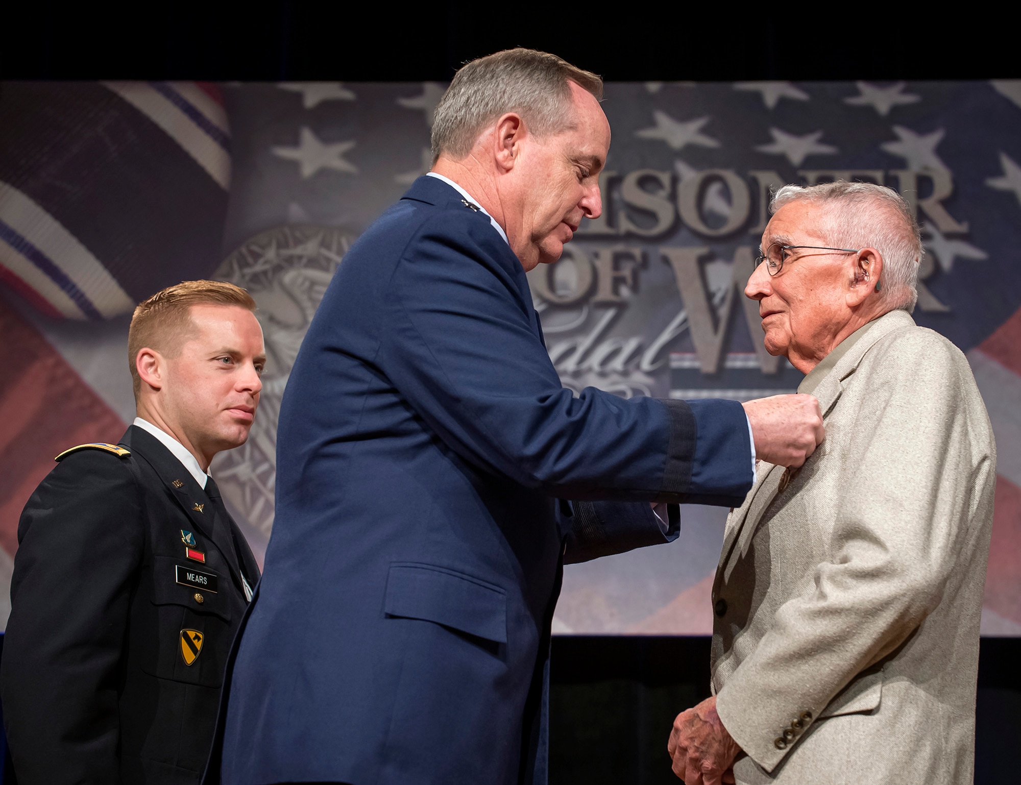 Air Force Chief of Staff Gen. Mark A. Welsh III presented the  Prisoner of War Medal to 1st Lt. Paul Gambaiana during a ceremony April 30, 2014, at the Pentagon. Gambaiana and eight other aviators, all bomber crew members, were shot down flying missions over Germany and were held in a prison camp in Wauwilermoos, Switzerland. The men were originally denied POW status. Then Acting Secretary of the Air Force Eric Fanning authorized the medal for 143 Army Air Corps Airmen in October 2013. (U.S. Air Force photo/Jim Varhegyi)