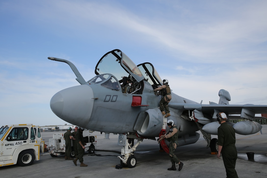 Marine Tactical Electronic Warfare Squadron 2 flight and ground crew inspect an EA-6B Prowler at Cherry Point April 17, before departing for low-level navigation training.


