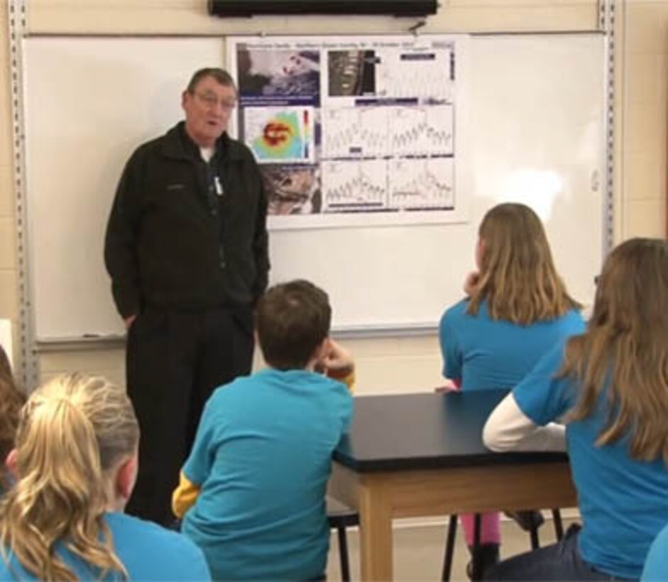 Jeff Gebert, Chief of Coastal Planning from the U.S. Army Corps of Engineers' Philadelphia District, speaks with fifth-graders from Brick Township, N.J. The students developed projects designed to tackle tidal flooding in the community, which was hit hard by Hurricane Sandy. 