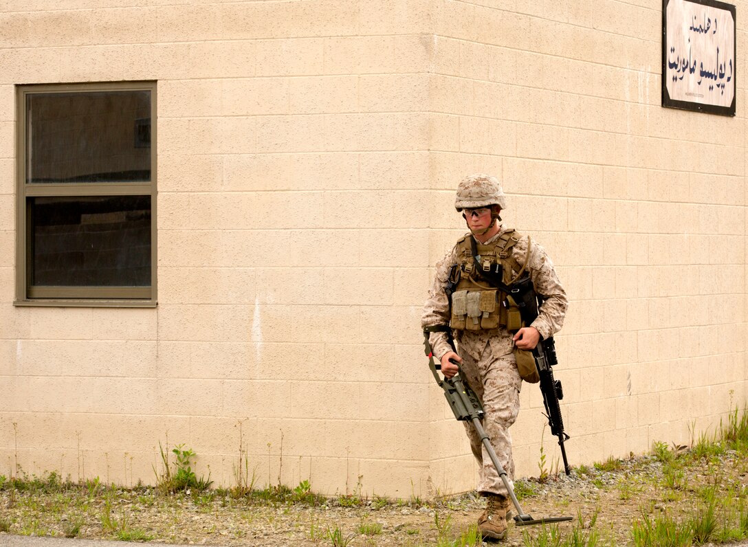 Pfc. Cole Graves, a combat engineer with Bravo Company, 2nd Combat Engineer Battalion’s, searches for improvised explosive devices with a metal detector during a counter IED course held at the Marine Corps Engineer School’s Home Station Training Lanes in Holly Ridge, N.C., April 25. The training area has 4.5 kilometers of roads with overpasses, round-abouts, intersections and two villages.