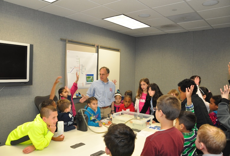 Raymond Schembri, lead civil engineer, informing children about the Army Corps' Navigation Mission. Bring Your Child to Work Day - STEM Event