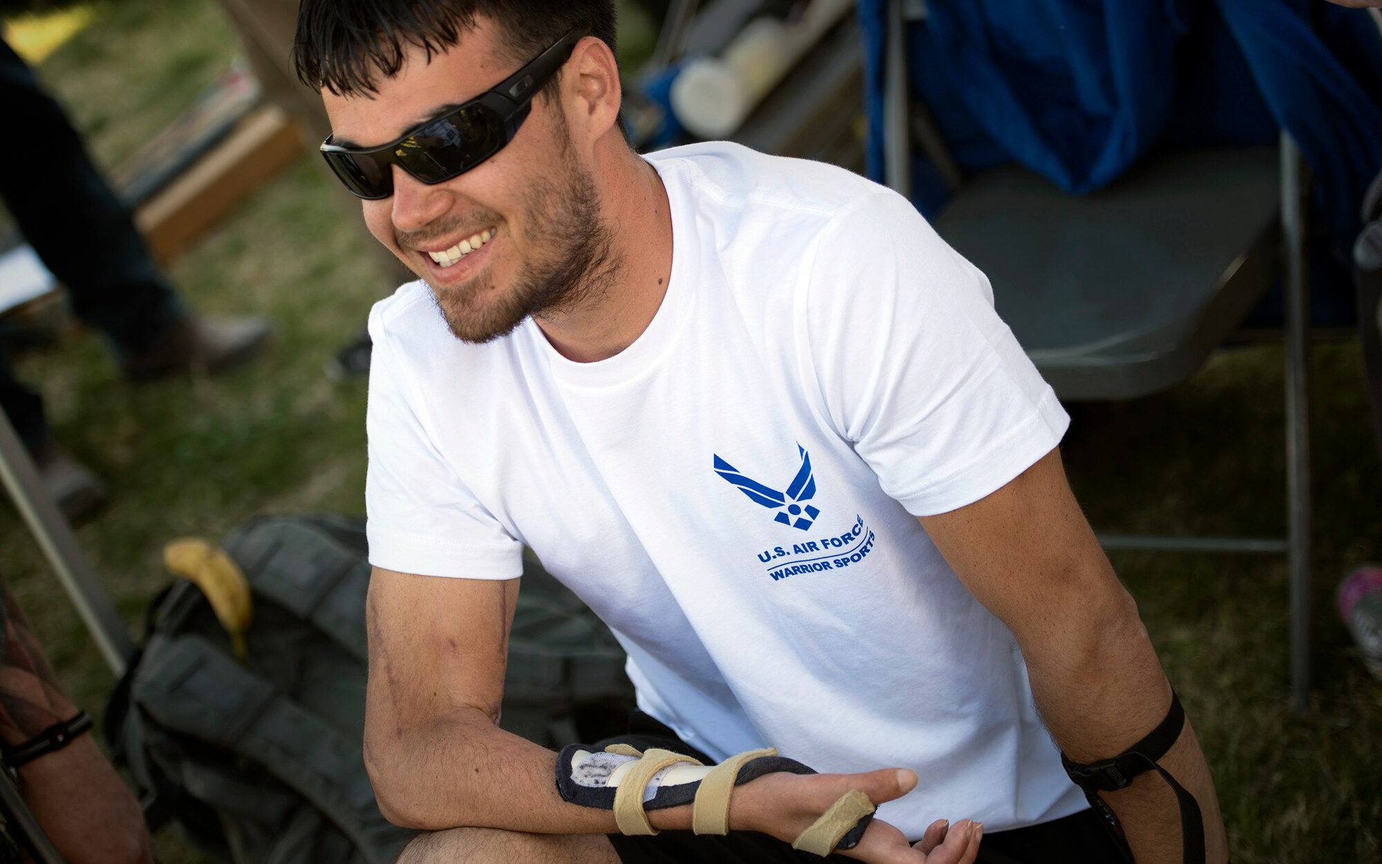 Retired Staff Sgt. Daniel Crane takes a break during an archery competition April 10, 2014, at the Air Force Trials at Nellis Air Force Base, Nev.  After a gunshot wound left his right forearm and hand immobile, Crane immersed himself in adaptive sports, where he has learned new ways to overcome his limitations.  (U.S. Air Force photo/Senior Airman Jette Carr) 