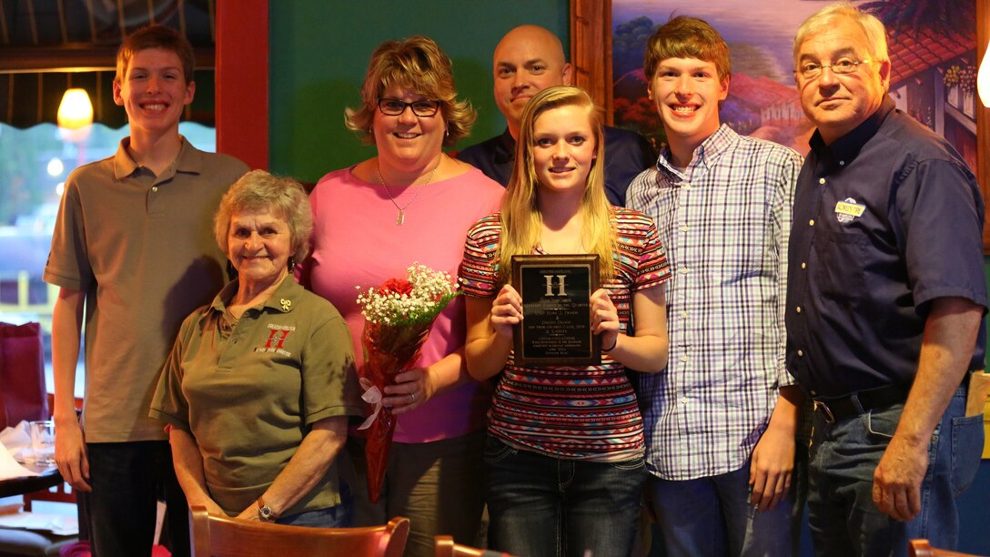 Master Sgt. Mark Francis and family pose for a photo after receiving the Marine Family of the Quarter Award from the Havelock Chamber of Commerce; Military Affairs Committee at El Cerro Grande Mexican Bar and Grill in Havelock, N.C., April 22, 2014. Francis and his family volunteered countless hours supporting Havelock High School extra-curricular activities. Francis is an intelligence analyst with Marine Wing Headquarters Squadron 2.