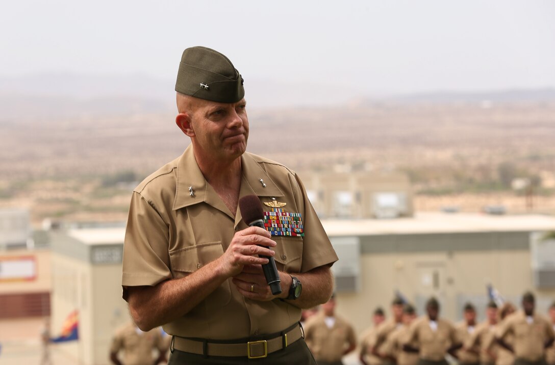 Maj. Gen. David H. Berger, Marine Air Ground Task Force Training Command, Marine Corps Air Ground Combat Center Commanding General, addresses the crowd during the Navy Cross award ceremony for Gunnery Sgt. Richard A. Jibson, Battle Staff Training Program team member, Marine Corps Tactics and Operations Group, held at Lance Corporal Torrey L. Gray Field April 22, 2014. Berger shares his remarks on the leadership qualities that Jibson displayed while advising a 53-man coalition force consisting of different countries. (Official Marine Corps photo by Cpl. Charles Santamaria/Released)