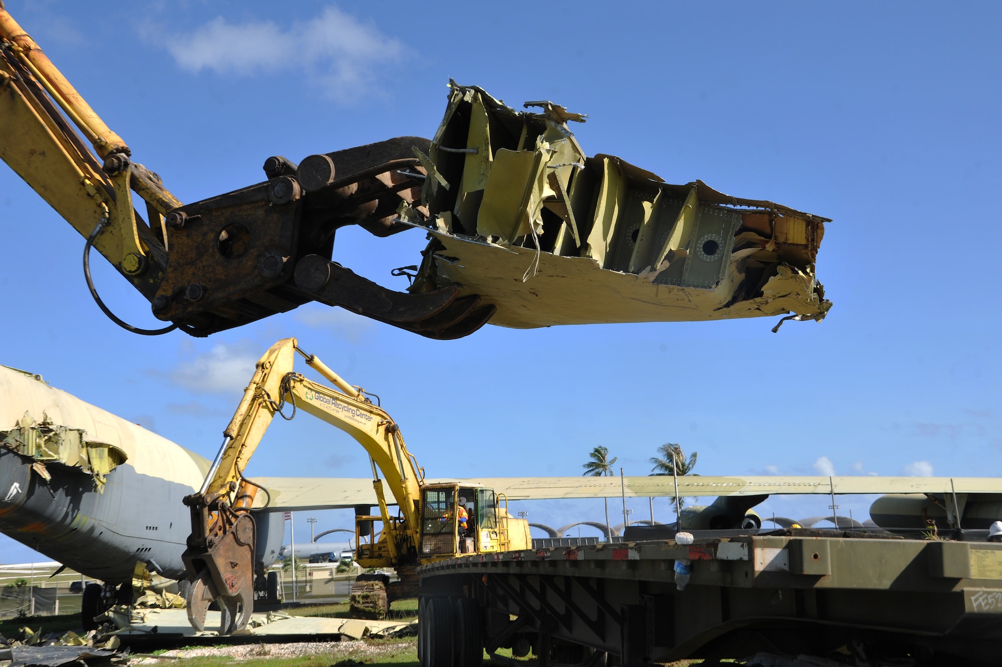 A piece of the “Old-100” static display B-52D Stratofortress at Arc Light Memorial Park is placed on a truck April 22, 2014 on Andersen Air Force Base, Guam. The aircraft was removed due to irreparable deterioration from weather after being on display for more than 30 years. (U.S. Air Force photo by Senior Airman Cierra Presentado/Released)