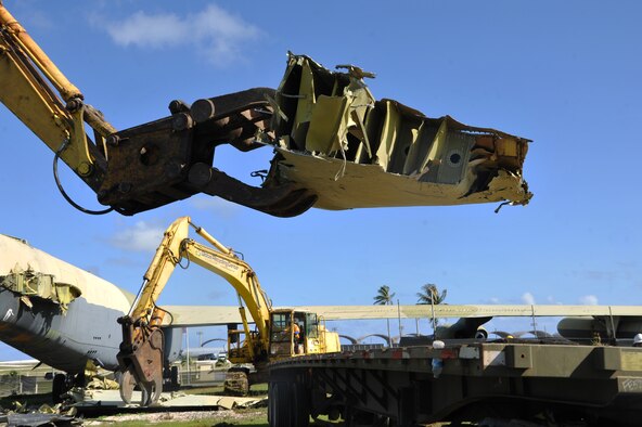 A piece of the “Old-100” static display B-52D Stratofortress at Arc Light Memorial Park is placed on a truck April 22, 2014 on Andersen Air Force Base, Guam. The aircraft was removed due to irreparable deterioration from weather after being on display for more than 30 years. (U.S. Air Force photo by Senior Airman Cierra Presentado/Released)