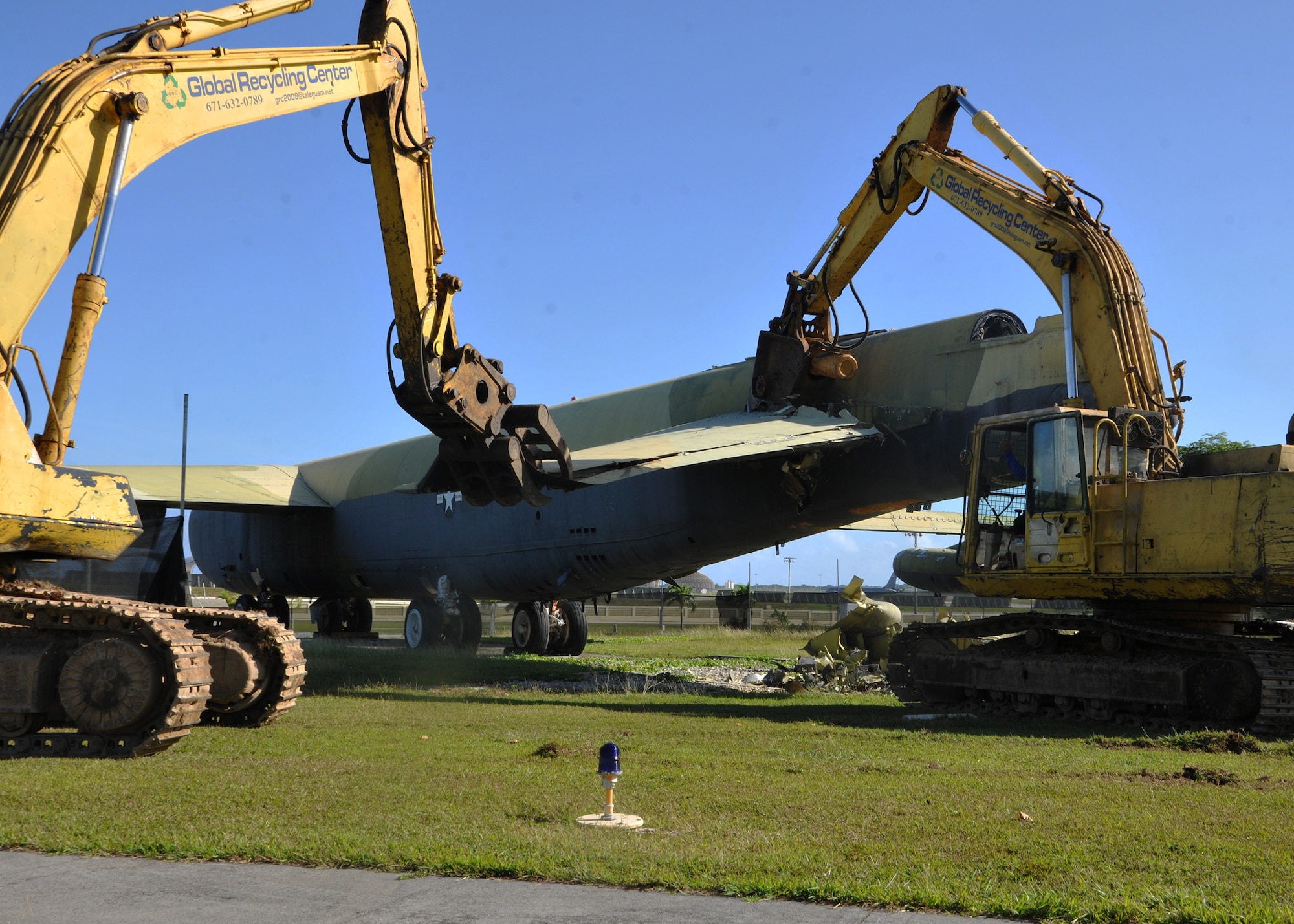 A wing section of the “Old-100” static display B-52D Stratofortress at Arc Light Memorial Park is removed April 22, 2014 on Andersen Air Force Base, Guam. Although the B-52D was removed from the site, the vertical tail section was being preserved and will be part of a redesigned memorial.  (U.S. Air Force photo by Senior Airman Cierra Presentado/Released)