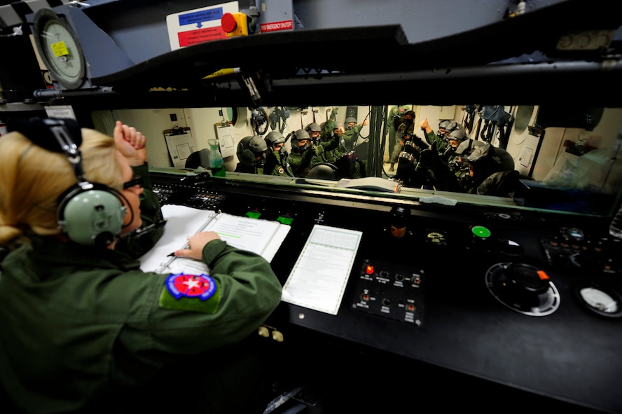 Airman 1st Class Brittany McBee, 47th Medical Operations Squadron aerospace physiology technician, performs an operation check on life support equipment in the hypobaric chamber at the Aerospace Physiology Unit on Laughlin Air Force Base, Texas, April 30, 2014. The Aerospace Physiology Unit uses the hypobaric chamber to train military, Department of Defense civilians and contractors on the effects of hypoxia, how to recognize their personal symptoms of hypoxia and make the necessary corrections to reverse the symptoms of the condition. (U.S. Air Force photo/Airman 1st Class Ariel D. Delgado/Released)