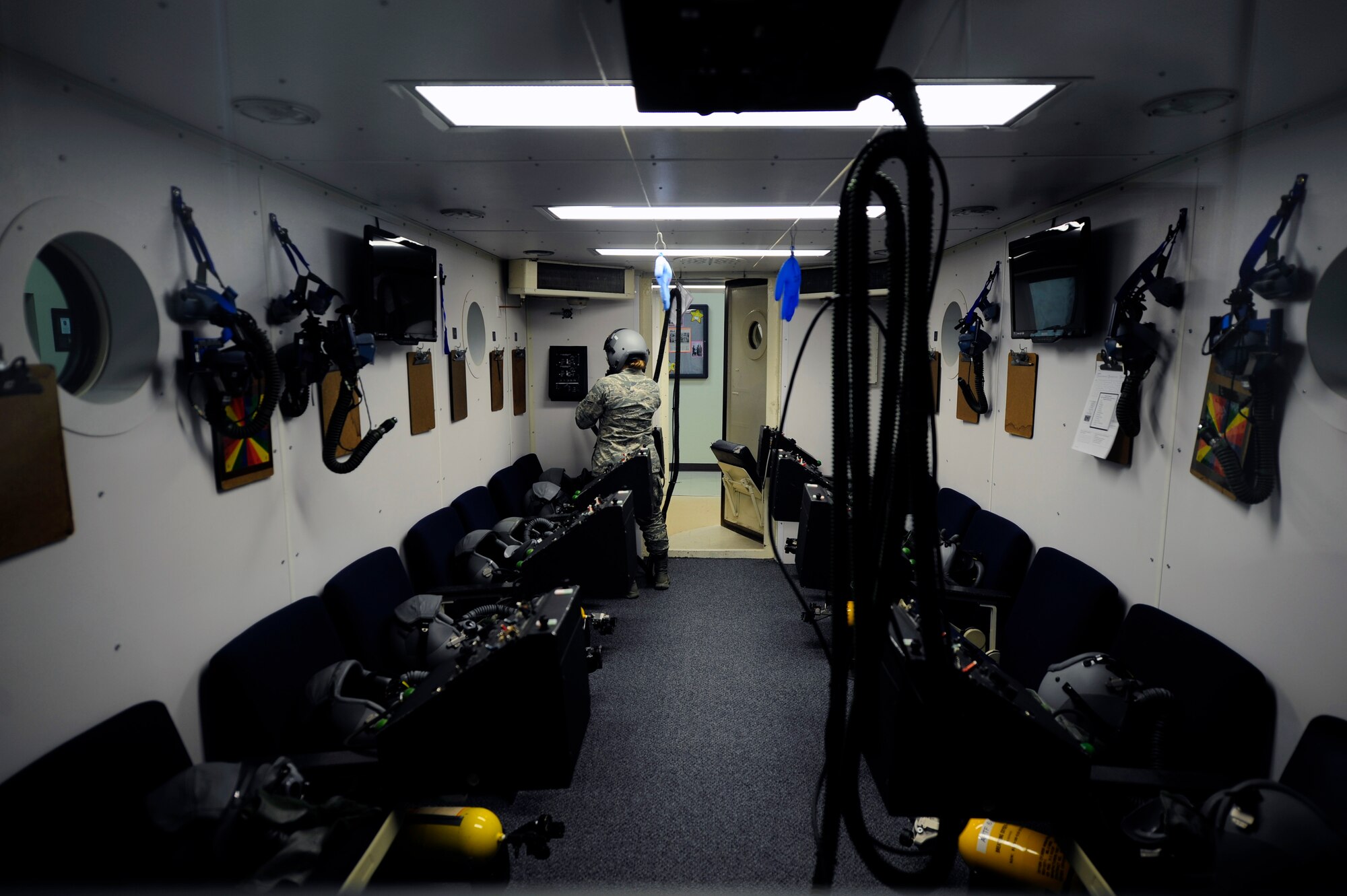 Airman 1st Class Ceara Vanloh, 47th Medical Operations Squadron aerospace physiology technician, checks her mask for a proper seal in the hypobaric chamber at the Aerospace Physiology Unit on Laughlin Air Force Base, Texas, April 30, 2014. Vanloh’s desire to have a job that would be hands-on and deal directly with the Air Force mission was important to her and inspired her to pursue a career as an aerospace physiology technician. (U.S. Air Force photo/Staff Sgt. Steven R. Doty/Released)