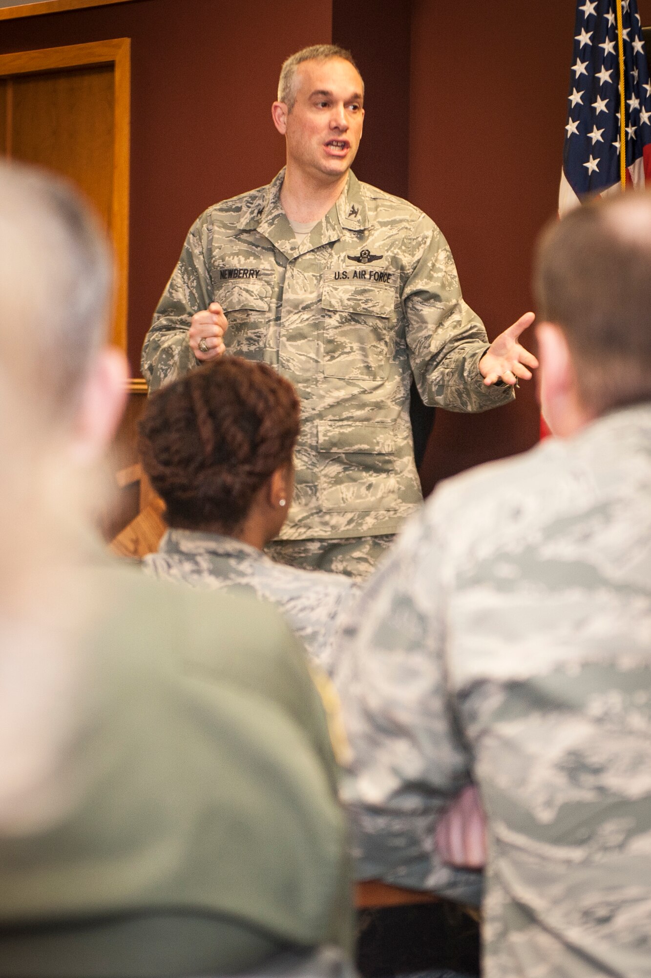Col. Brian Newberry talks with attendees of a Holocaust remembrance breakfast in the Warrior Dining Facility at Fairchild Air Force Base, Wash., May 1, 2014. Guest speaker, Rabbi Yisroel Hahn, showed Airmen how they can ensure such genocide is never repeated. Newberry is the 92nd Air Refueling Wing commander and Hahn leads the Jewish community center in Spokane, Wash., called the Chabad Center. (U.S. Air Force photo by Staff Sgt. Benjamin W. Stratton/Released)