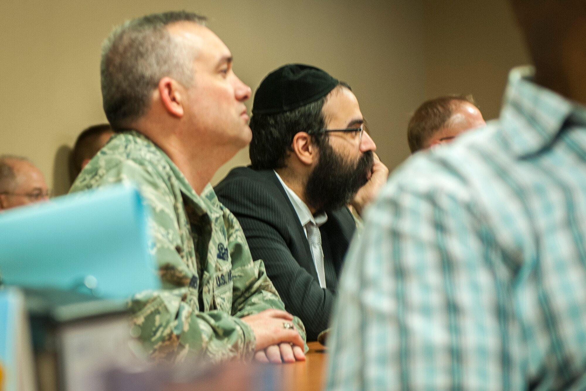 Col. Brian Newberry and Rabbi Yisroel Hahn together reflect as Holocaust events are remembered during a breakfast in the Warrior Dining Facility at Fairchild Air Force Base, Wash., May 1, 2014. Newberry is the 92nd Air Refueling Wing commander and Hahn leads the Jewish community center in Spokane, Wash., called the Chabad Center. (U.S. Air Force photo by Staff Sgt. Benjamin W. Stratton/Released)
