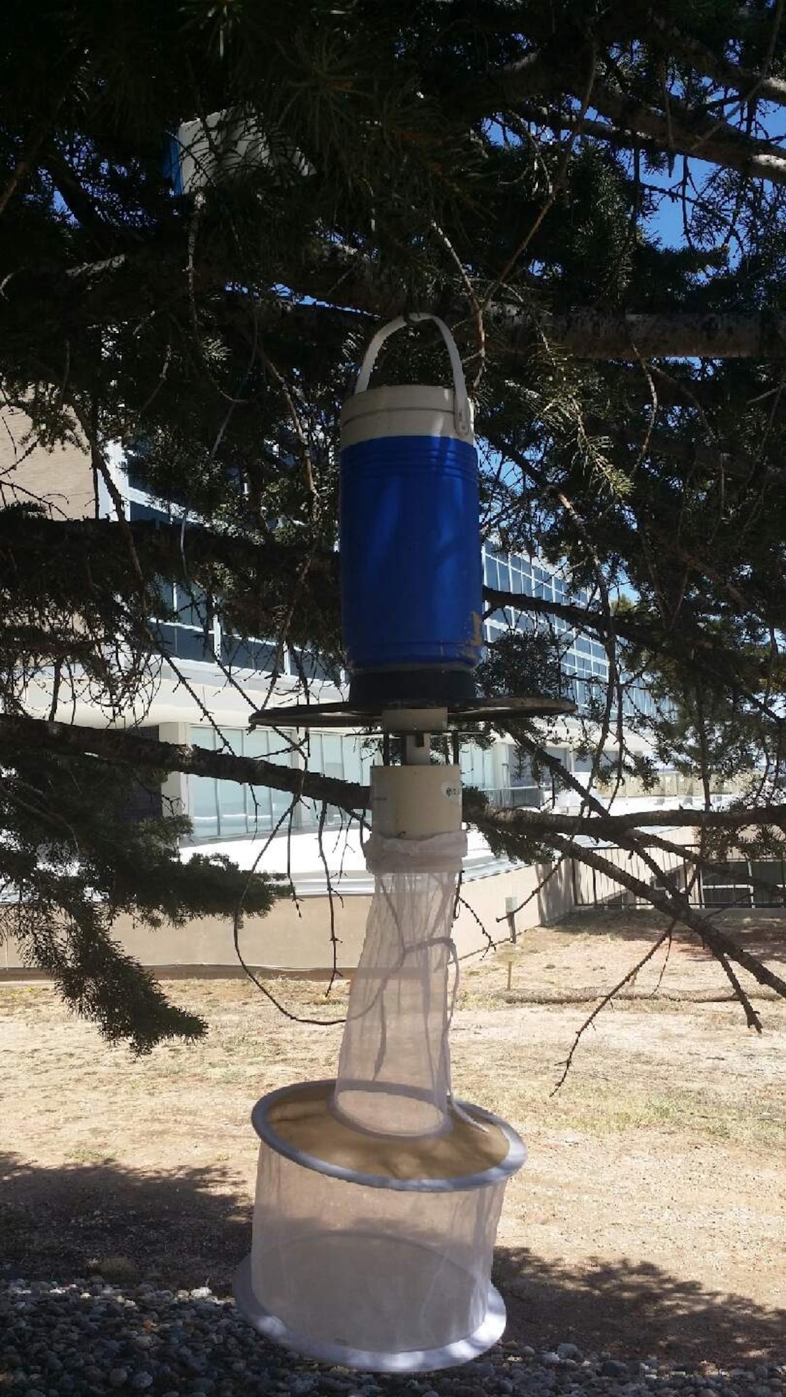 A New Jersey Light Trap for mosquitoes hangs from a tree at the Academy April 18. Starting May 1, the 10th Medical Group Public Health office will be placing mosquito traps in areas throughout the Academy. (U.S. Air Force/Courtesy Photo)