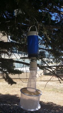 A New Jersey Light Trap for mosquitoes hangs from a tree at the Academy April 18. Starting May 1, the 10th Medical Group Public Health office will be placing mosquito traps in areas throughout the Academy. (U.S. Air Force/Courtesy Photo)