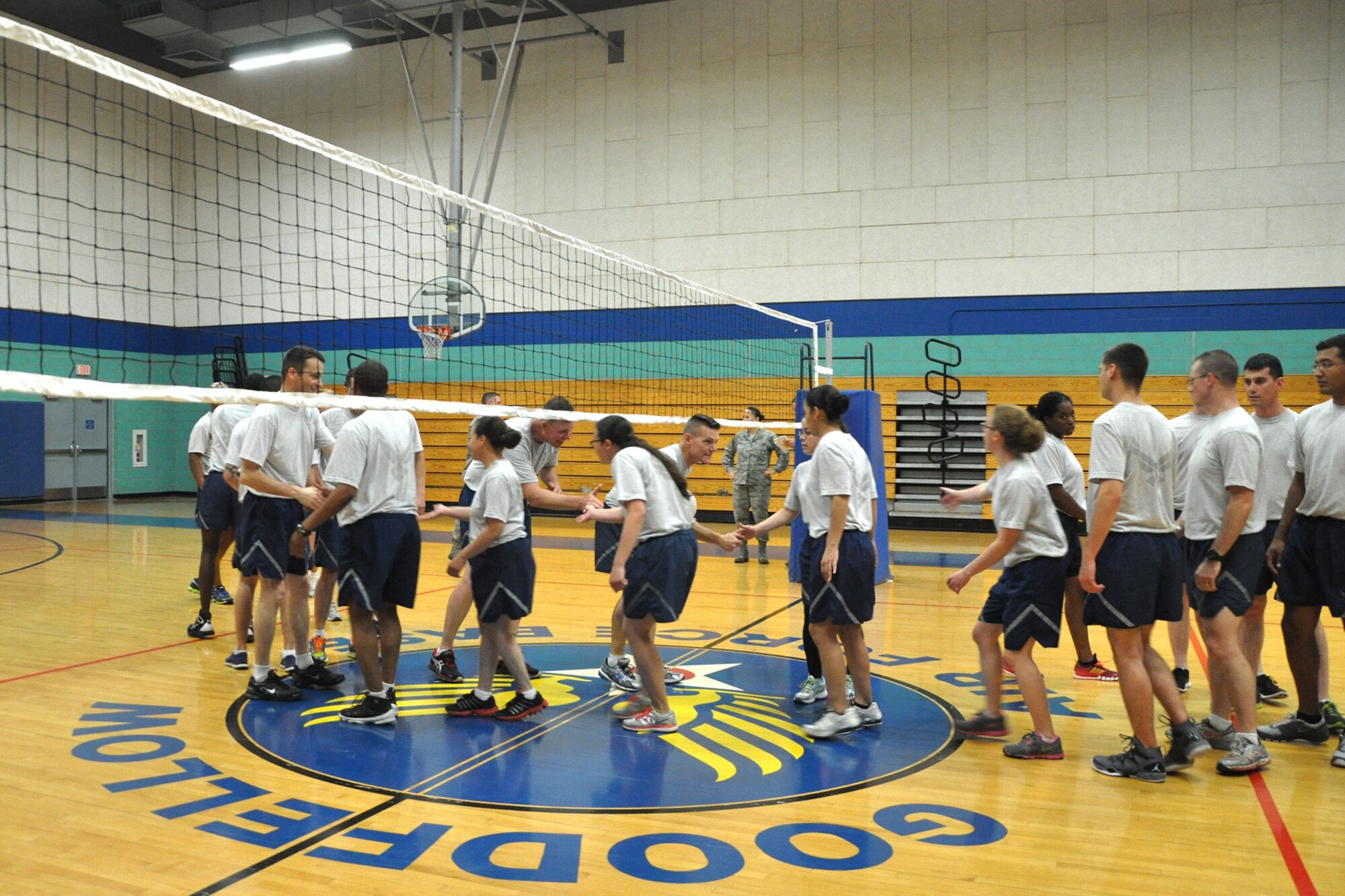 GOODFELLOW AIR FORCE BASE, Texas -- The Airman Leadership School Class 14-C congratulates the eagles and chiefs on their victory after their volleyball match at the Mathis Fitness Center April 22. In order to win the volleyball match, the team had to win two out of three games. (U.S. Air Force photo/ Airman 1st Class Breonna Veal)