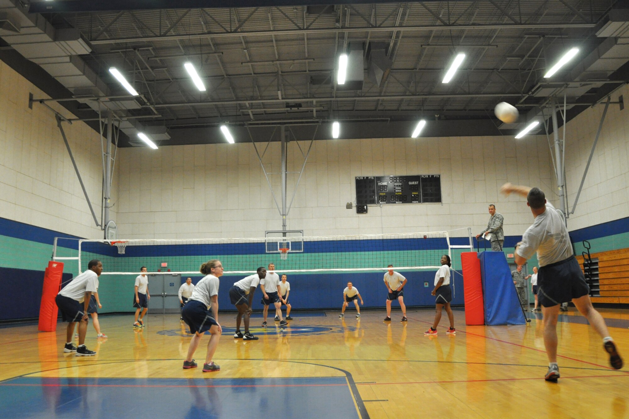GOODFELLOW AIR FORCE BASE, Texas –  An Airman Leadership School Class 14-C member serves a volleyball over the net during the volleyball match with the eagles and chiefs at the Mathis Fitness Center April 22. Prior to the volleyball games, the class began with a Q-and-A board with the chief master sergeants on base. (U.S. Air Force photo/ Airman 1st Class Breonna Veal)