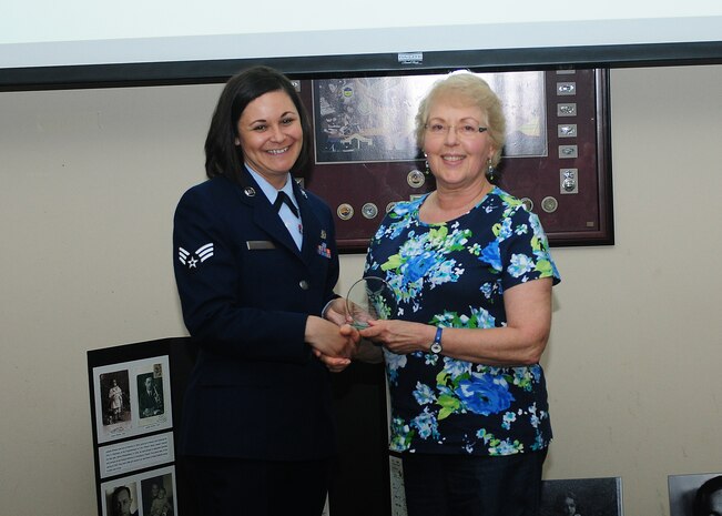 Senior Airman Kaitlin Massey, Holocaust Remembrance committee member, presents Maria Winkler, daughter of Dr. Joseph Winkler, a holocaust survivor, with a token of appreciation during the Holocaust Remembrance Breakfast at the Recce Point Club on Beale Air Force Base, Calif., May 1, 2014. Winkler was a guest speaker for the event. (U.S. Air Force photo by Senior Airman Allen Pollard/Released)