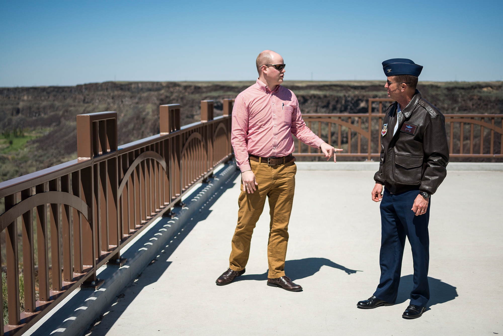 Kyle Tarbet (left), marketing coordinator for the Twin Falls Area Chamber of Commerce, talks with U.S. Air Force Col. Dave Iverson, 366th Fighter Wing commander, at a scenic overlook in Twin Falls, Idaho, April 30, 2014.  (U.S. Air Force photo by Tech. Sgt. Samuel Morse)