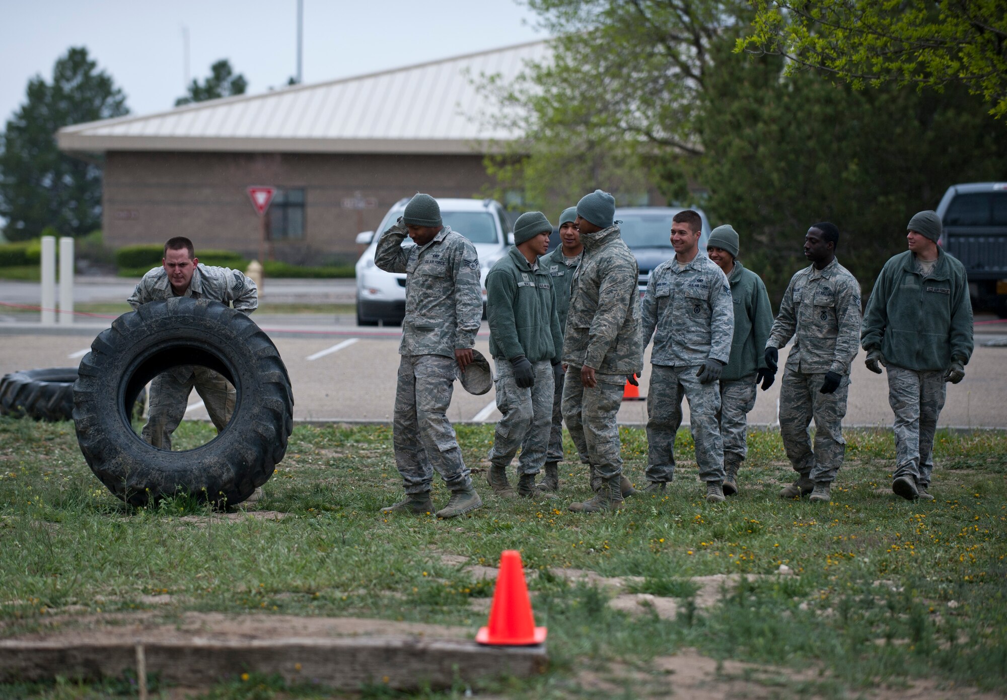 Staff Sgt. Richard Swanson, 366th Security Forces Squadron flight S30A2 response force leader, flips a tire, April 22, 2014, at Mountain Home Air Force Base, Idaho. The Defenders Edge Resiliency Challenge gave Airmen the opportunity for team building with their individual flights as part of their monthly training plan. (U.S. Air Force Photo by Airman 1st Class Brittany A. Chase/Released)