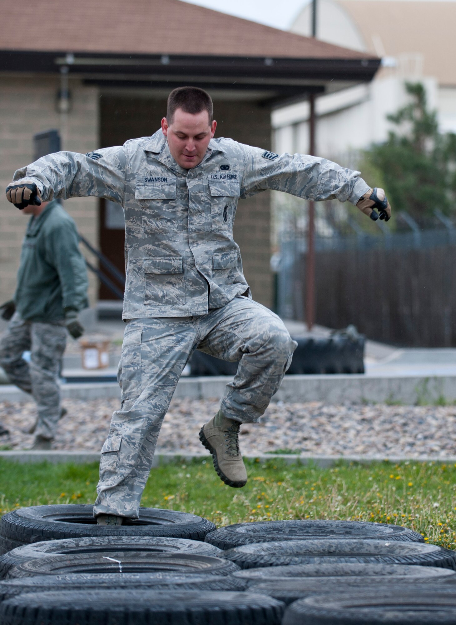 Staff Sgt. Richard Swanson, 366th Security Forces Squadron flight S30A2 response force leader, runs through tires, April 22, 2014, at Mountain Home Air Force Base, Idaho. Swanson took part in the Defenders Edge Resiliency Challenge which helps promote team building amongst each SFS flight. (U.S. Air Force Photo by Airman 1st Class Brittany A. Chase/Released)