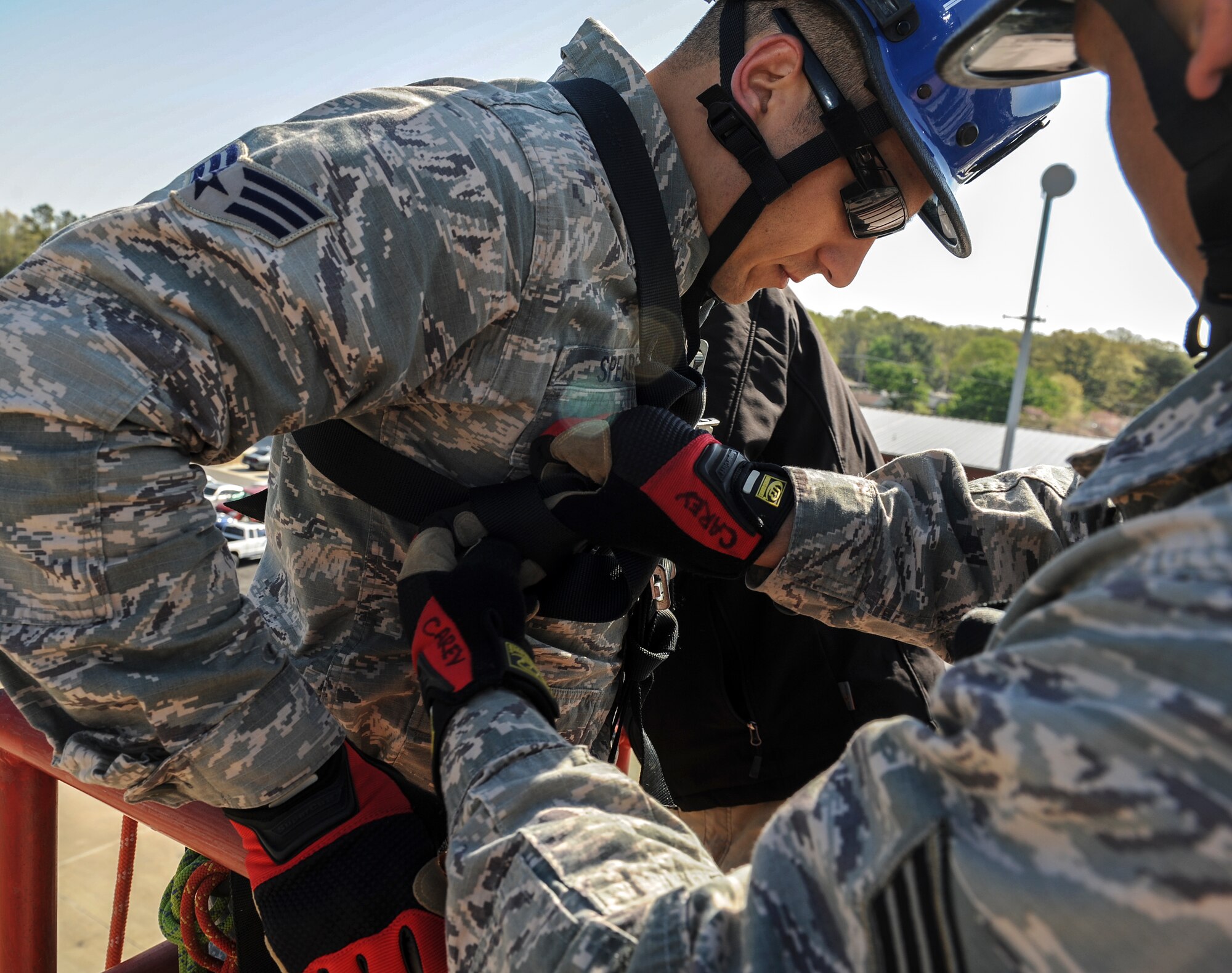 Senior Airman Alexander Spears, a 19th Civil Engineer Squadron firefighter, prepares to rappel from a burn building by having a safety check performed by a fellow firefighter April 16, 2014, at the Jacksonville Fire Department, Jacksonville, Ark. More than 11 Team Little Rock firefighters attended the Rescue Technician Course, totaling 23 certified rescue technicians for Team Little Rock. (U.S. Air Force photo by Staff Sgt. Jessica Condit)