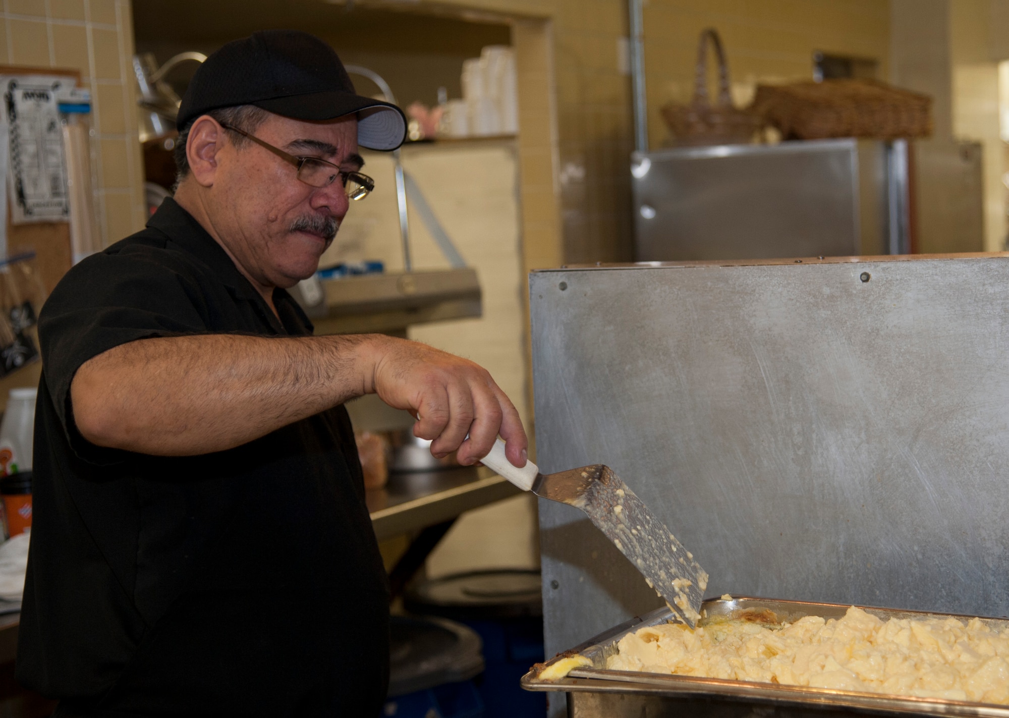Juan Celedon, Club XL’s cook supervisor, prepares eggs for pilot training class 14-08’s graduation breakfast at Club XL on Laughlin Air Force Base, Texas, April 24, 2014. As much as 17 dozens eggs will be scrambled for the graduating class’ breakfast buffet. (U.S. Air Force photo/Airman 1st Class Jimmie D. Pike/Released)     