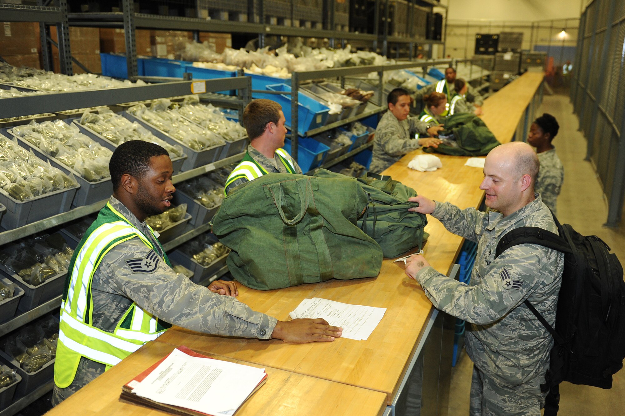 Team Little Rock Airmen complete a portion of the deployment line during a RockEx, April 22, 2014, at Little Rock Air Force Base, Ark. During a deployment line Airmen typically receive record checks, equipment issue, briefs and personal assistance. (U.S. Air Force photo by Tech. Sgt. Chad Chisholm)