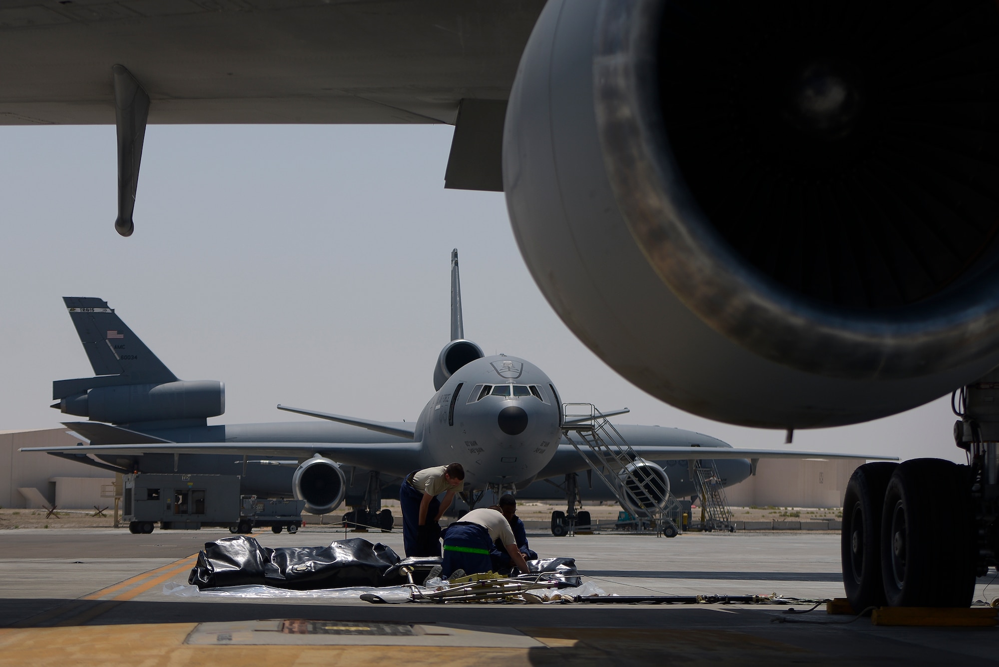 Fuel systems Airmen from the 380th Expeditionary Aircraft Maintenance Squadron prepare a fuel cell for installation April 28, 2014, at an undisclosed location in Southwest Asia. The KC-10 Extender is an aerial refueling aircraft which extends the reach of other aircraft. (U.S. Air Force photo byTech. Sgt. Russ Scalf/Released)