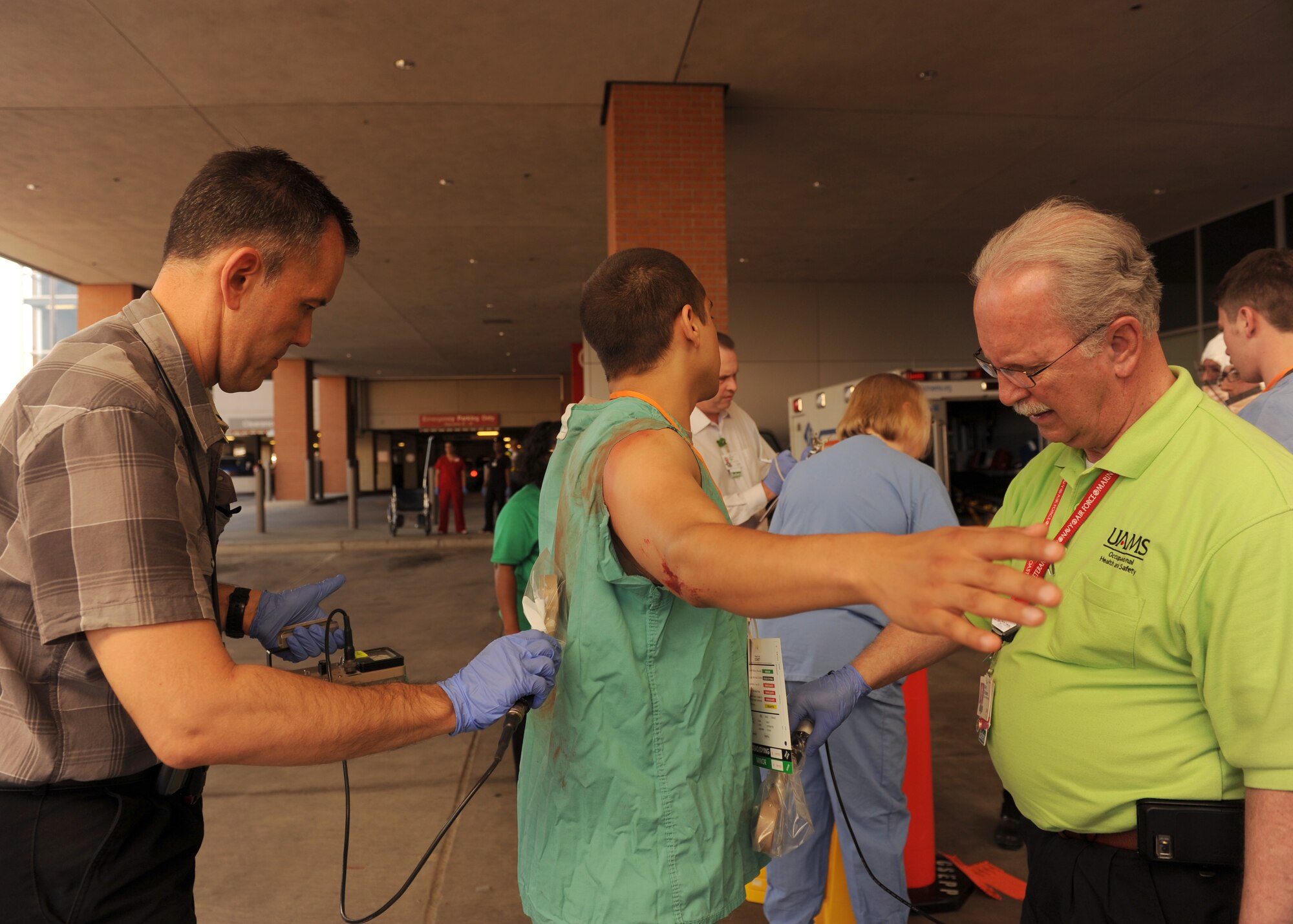 A Little Rock Air Force Base Airman is checked for radiation during a major accident response exercise at the University of Arkansas for Medical Sciences campus April 22, 2014. Airmen from the base simulated roles as hostages, injured victims of an explosion and victims exposed to radiation. (U.S. Air Force photo by Airman 1st Class Scott Poe)