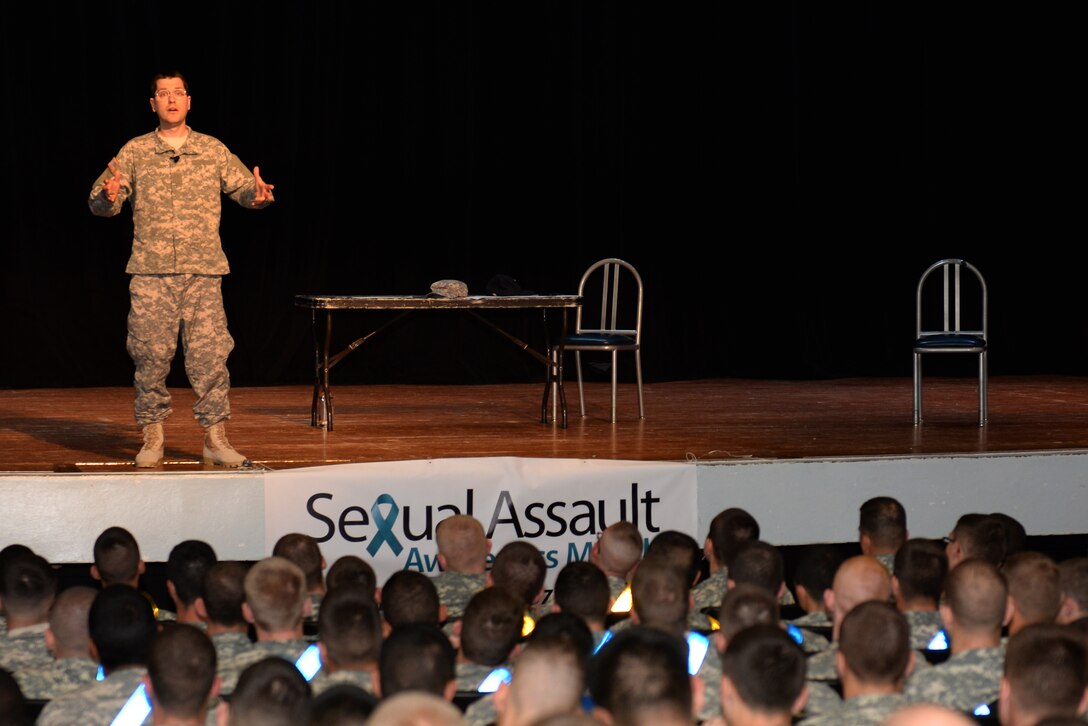 Tim Collins, a solo performer, portrays U.S. Army Soldiers during his show, “The Script”, as part of the installation’s Sexual Assault Awareness Month at Fort Eustis, Va., April 30, 2014. During the show, Collins portrayed four young Soldiers’ reactions to discovering the sexual assault of a mutual friend. (U.S. Air Force photo by Senior Airman Teresa J.C. Aber/Released)