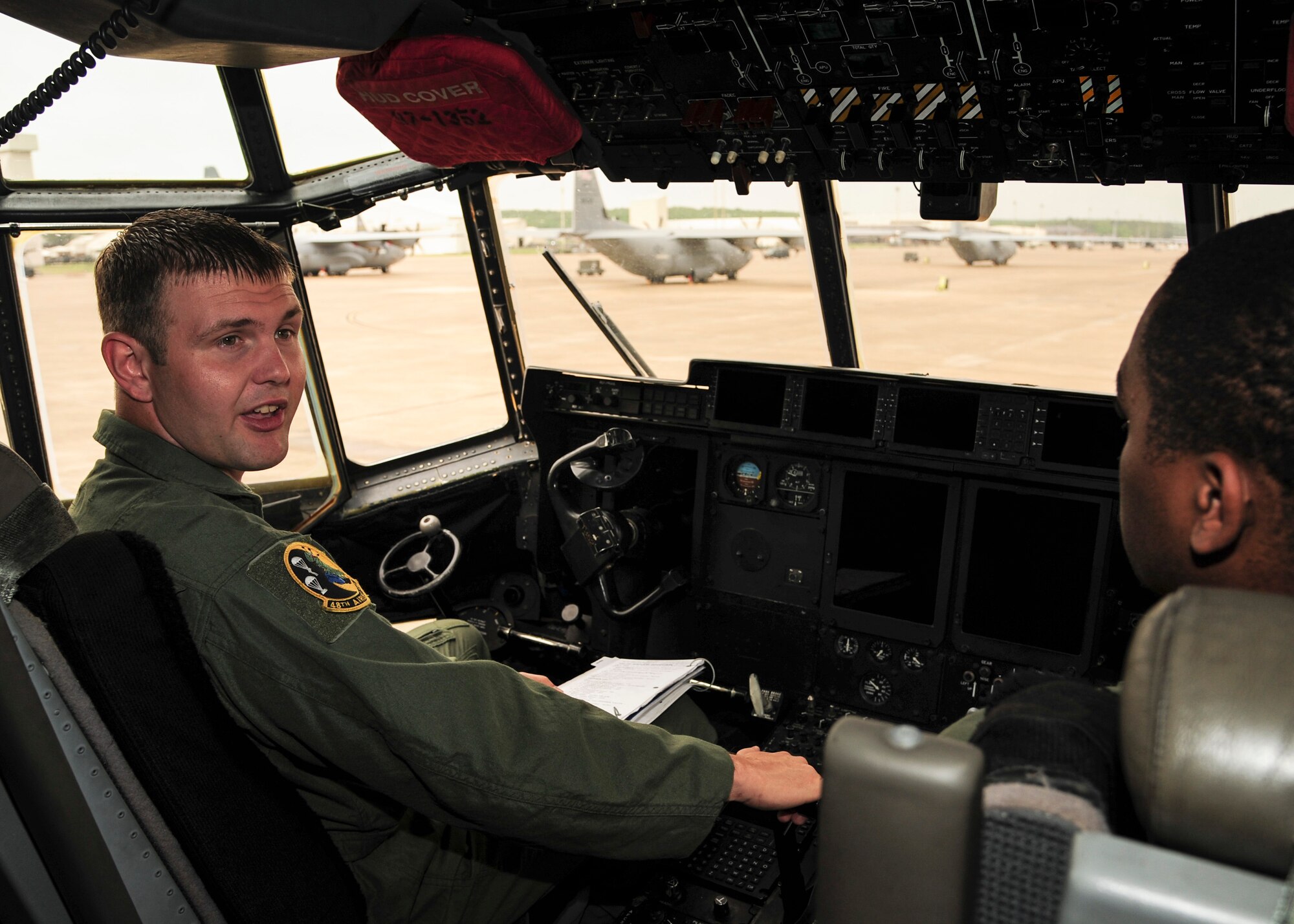 Senior Airman Dustin Rice, a 48th Airlift Squadron standardization and evaluation liaison, instructs a student on proper power up techniques for a C-130J April 28, 2014, at Little Rock Air Force Base, Ark. Rice oversaw evaluation documentation for all C-130J students, validating course completion and qualification for 306 check rides in four months. (U.S. Air Force photo by Airman 1st Class Harry Brexel)