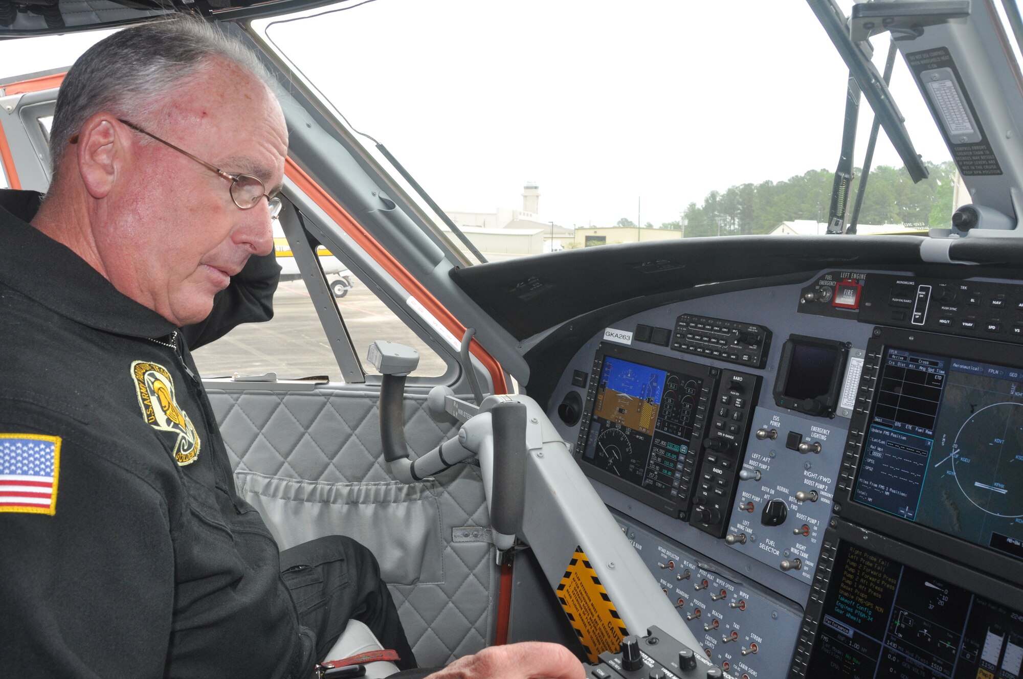 POPE FIELD, N.C. - Retired Chief Warrant Officer 5 Ken Breeden, US Army Parachute Team here, demonstrates the safety feature of the Traffic Collision Avoidance System on board a UV-18C Twin Otter 400, as part of a comprehensive Mid-Air Collision Avoidance program.  Breeden said the TCAS displayed a target, or aircraft, more than 11 miles away and 7800 feet above his current location.  Collision avoidance systems such as TCAS, Terrain Warning Systems, weather warning systems, transponders and communication between flight crews, Air Traffic Control and Ground Control all contribute to the safe operation of aircraft, said Breeden. (U.S. Air Force photo by Tech. Sgt. Elizabeth Moody)