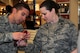 U.S. Air Force 1st Lt. John Kulikowski, 35th Civil Engineer Squadron officer in charge of requirements and optimization, shows Lt. Col. Beverly Templeman, 373rd Intelligence, Surveillance and Reconnaissance Group deputy commander, the correct symbol and number to look for on acceptable recycle products on Misawa Air Base, Japan, April 22, 2014.  Unlike the U.S. where most plastic and glass products are recyclable, in Misawa they will soon only be accepting number “1” products. Be on the lookout for the recycling article next month. (U.S. Air Force photo/ Tech. Sgt. April Quintanilla)