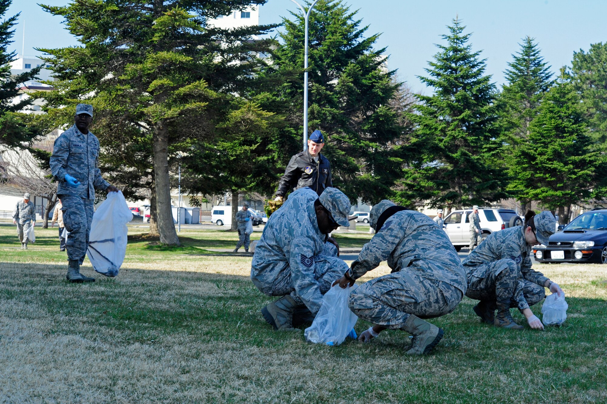 Members from 35 Fighter Wing Staff Agency volunteer their time to pick up trash around Misawa Air Base in recognition of Earth Day April 21, 2014.  To celebrate Earth Day, the base held multiple cleanups throughout the week promoting a clean environment and providing information to base residents about environmental programs and Misawa City’s recycling policy. (U.S. Air Force photo/ Tech. Sgt. April Quintanilla)