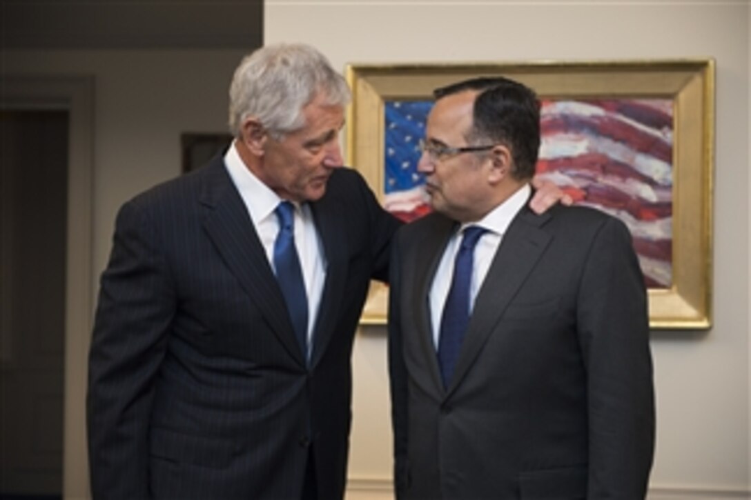 U.S. Defense Secretary Chuck Hagel, right, hosts a meeting with Egyptian Foreign Affairs Minister Nabil Fahmy at the Pentagon, April 30, 2014. The two leaders met to discuss issues of mutual importance. 