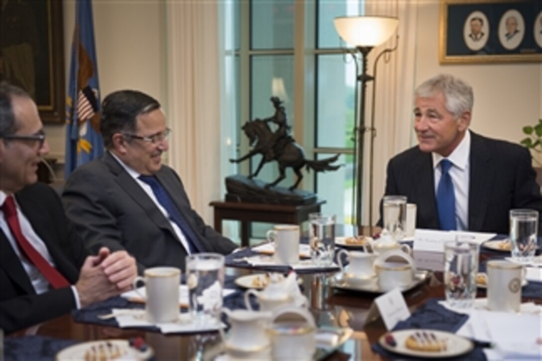 U.S. Defense Secretary Chuck Hagel, right, hosts a meeting with Egyptian Foreign Affairs Minister Nabil Fahmy at the Pentagon, April 30, 2014. The two leaders met to discuss issues of mutual importance. 