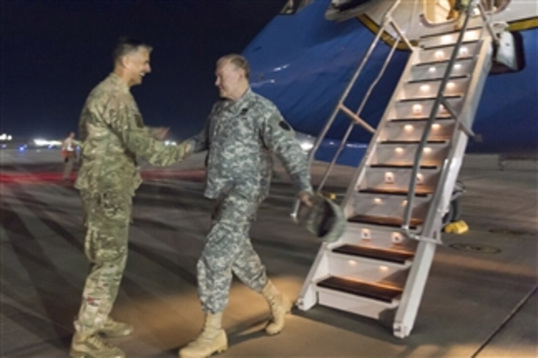 U.S. Army Gen. Martin E. Dempsey, chairman of the Joint Chiefs of Staff, is greeted by U.S. Army Maj. Gen. Stephen J. Townsend, commander of the 10th Mountain Division, upon his arrival on Bagram Airfield, Afghanistan, May 1, 2014. Dempsey is in Afghanistan to visit troops and commanders. 
