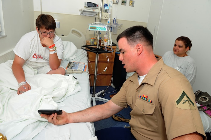 Lance Cpl. Tyler Spillenkothen with 2nd Battalion, 6th Marine Regiment, 2nd Marine Division, Marine Corps Base Camp Lejeune, N.C., talks with Cody Clark at the Joe DiMaggio Children's Hospital as part of Fleet Week Port Everglades, April 30. Marines with 2nd Battalion, 6th Marine Regiment, 2nd Marine Division, Marine Corps Base Camp Lejeune, N.C., Naval Mobile Construction Battalion 14 , Fort Lauderdale, Fla., and Sailors from the USS New York and Carrier Strike Group 12, visit children from the Joe DiMaggio Children's Hospital in Fort Lauderdale, Fla., April 30, as part of the 24th Anniversary Fleet Week Port Everglades. 