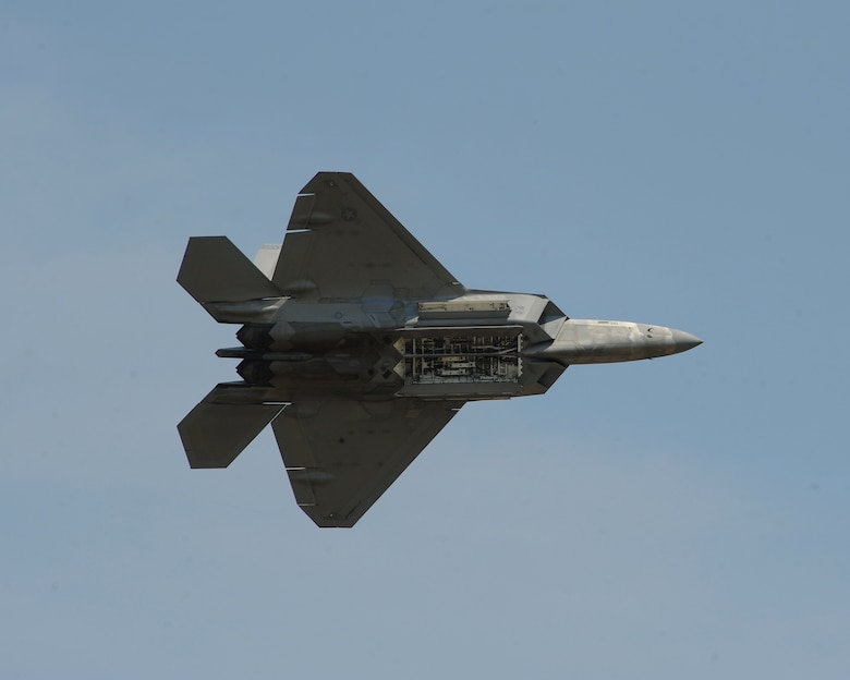 An F-22 Raptor opens its weapons bay April 26, 2014, during the Defenders of Liberty Air Show at Barksdale Air Force Base, La. The F-22 performs both air-to-air and air-to-ground missions allowing full realization of operational concepts vital to the 21st century Air Force. (U.S. Air Force photo/Senior Airman Benjamin Gonsier)