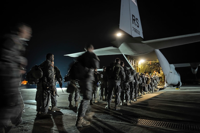 Paratroopers from the 173rd Infantry Brigade Combat Team (Airborne) board a C-130J Super Hercules from the 37th Airlift Squadron, April 26, 2014 at Aviano Air Base, Italy. Airmen from the 37th AS flew from Ramstein Air Base, Germany, to Aviano AB to pick up 150 paratroopers and then transported them to Siauliai Air Base, Lithuania. Upon their arrival, Lithuanian President, Dalia Grybauskaite, greeted the soldiers. (U.S. Air Force photo/Staff Sgt. Sara Keller)