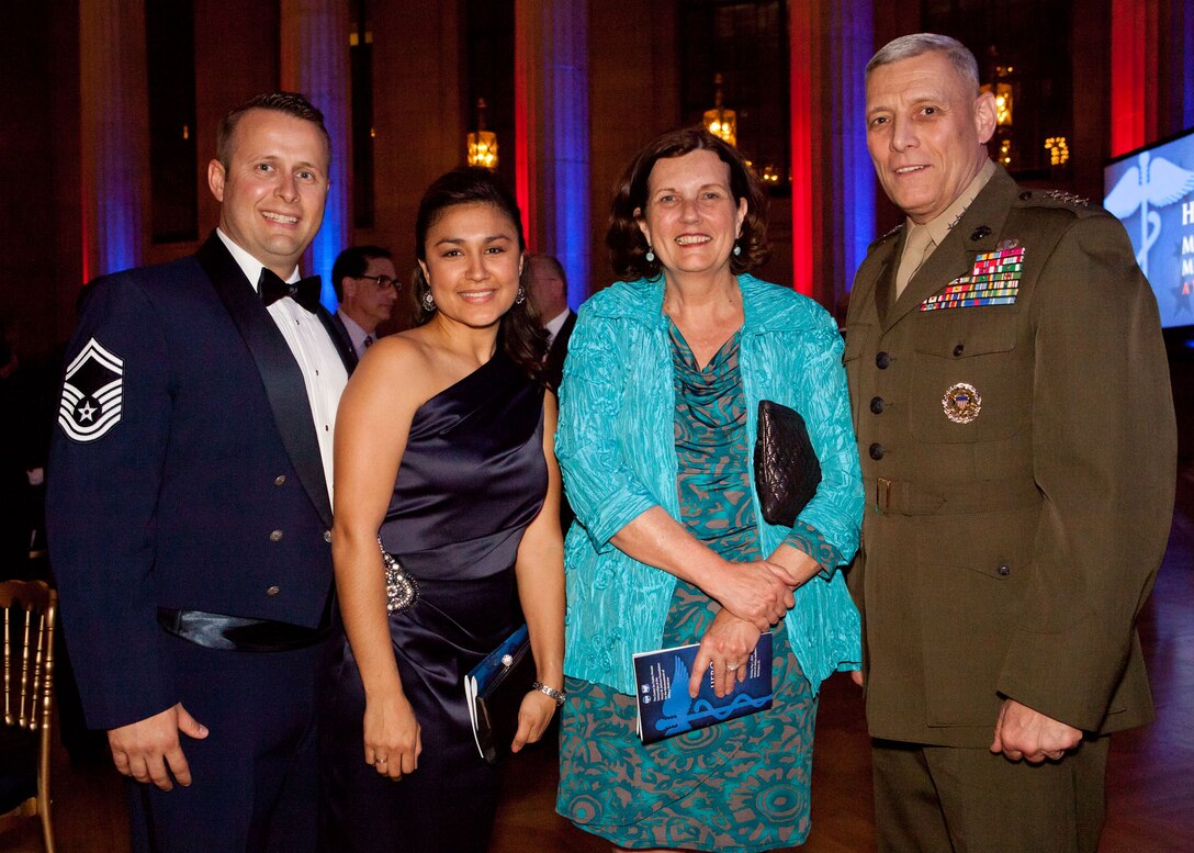 The Assistant Commandant of the Marine Corps, Gen. John M. Paxton, Jr., right, poses for a photo during the Heroes of Military Medicine Awards Dinner in Washington, D.C., April 1, 2014. Gen. Paxton helped present the United States Navy Hero of Military Medicine Award to U.S. Navy Captain Jack W. Tsao, not shown, that evening. (U.S. Marine Corps photo by Cpl. Tia Dufour/Released)